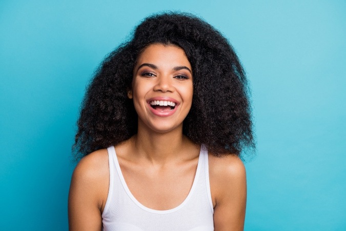 Young woman trying on dental veneers