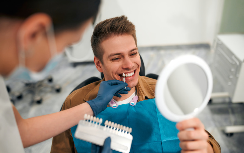 Patient smiling at the dentist after cosmetic dentistry