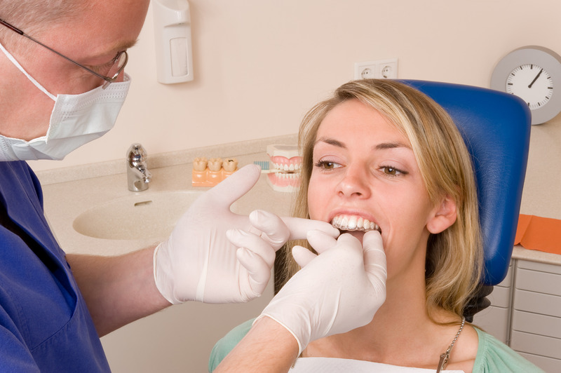 Patient being fitted with their SureSmile aligners